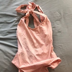 pink body suit
